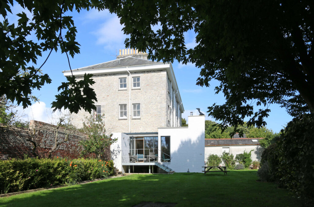 white brick and plymouth limestone. The square contemporary extension to listed townhouse. Threshold Architects Passivhaus Tim Offer South Devon South Hams