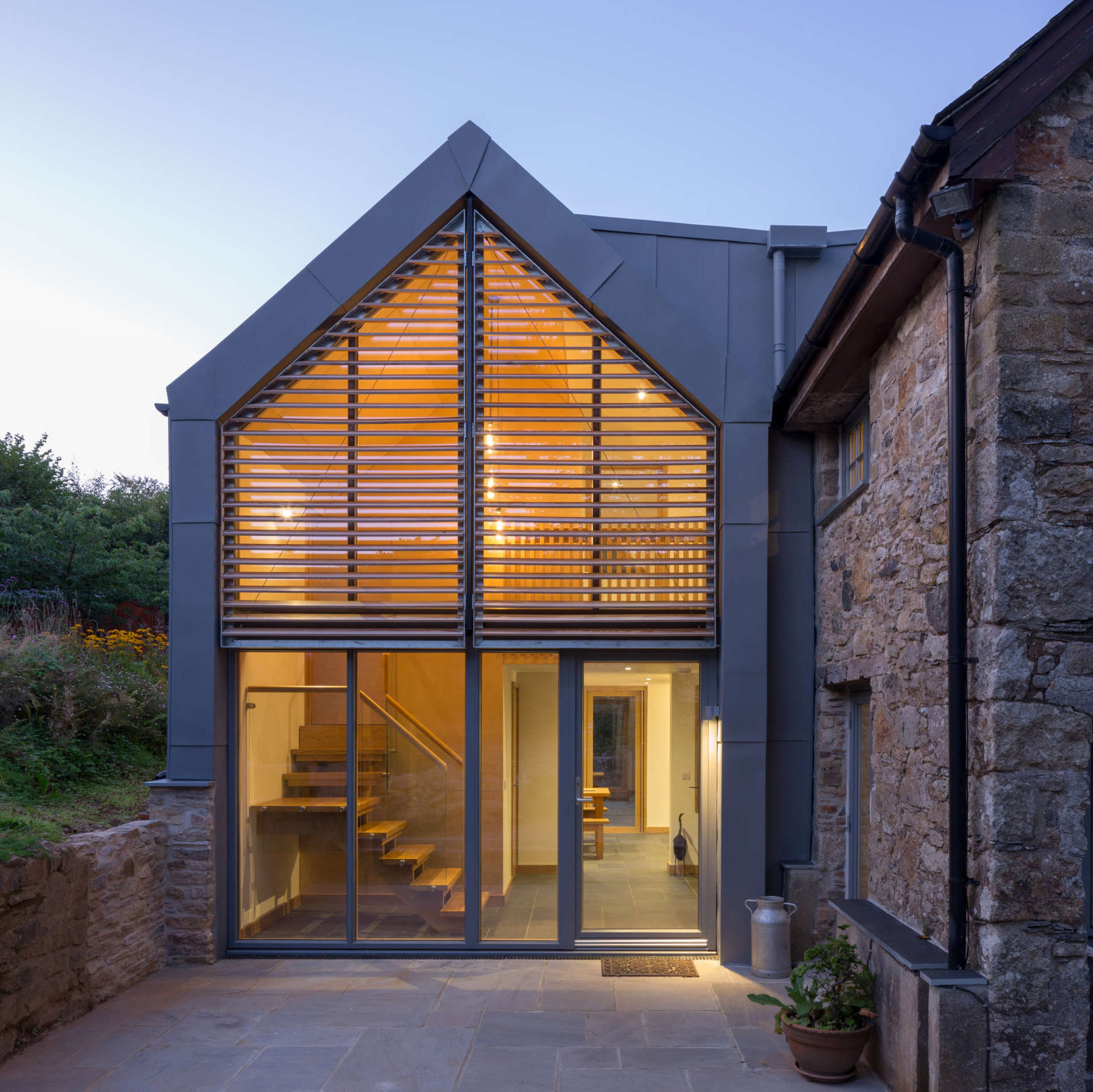 Glazed gable and zinc cladding. Lutterburn award winning barn conversion. Threshold Architects Passivhaus Tim Offer South Devon South Hams